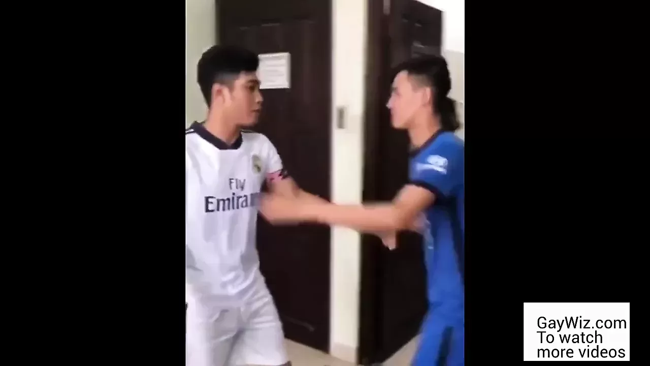 Two Asians wearing soccer uniform have sex